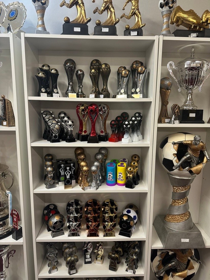 Trophy shelves with cups and star awards